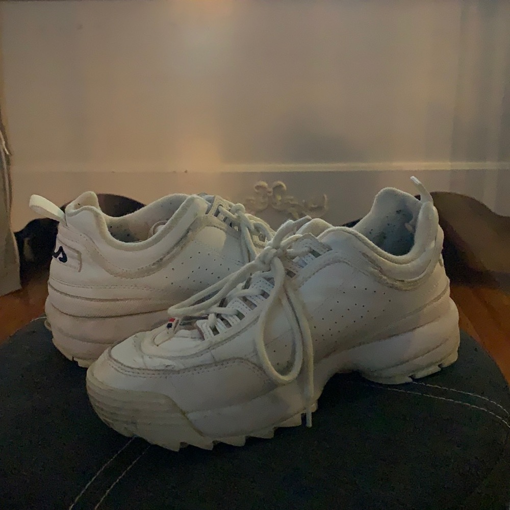 White Fila disruptors.